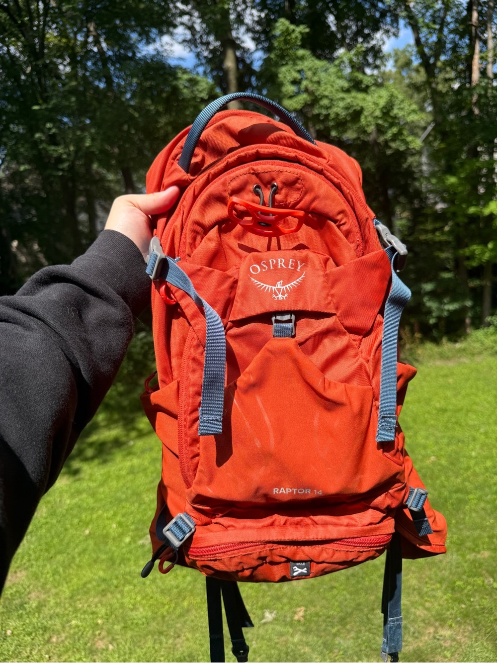 OSPREY Raptor 14 Backpack in vibrant orange with gray accents